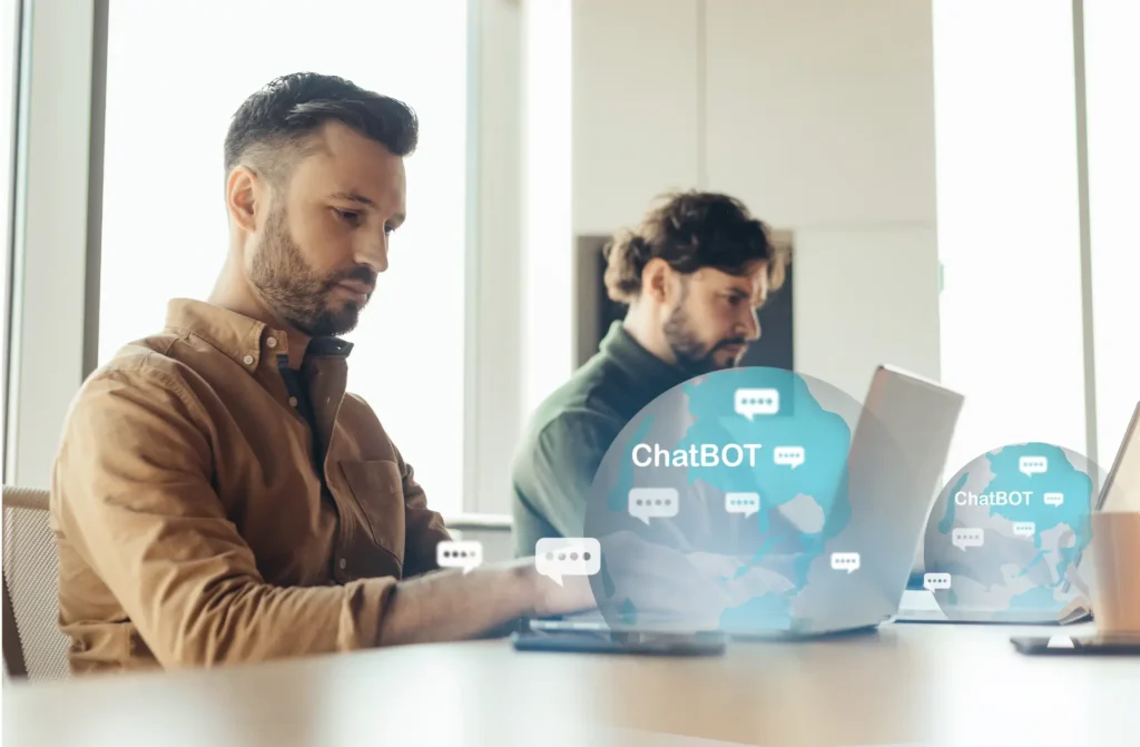 Como usar IA para aprender inglês: homem conversa com um chatbot no laptop em um escritório